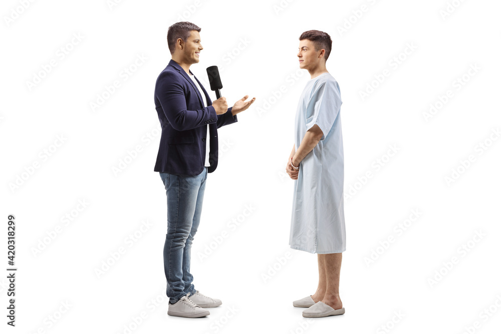 Reporter interviewing a young male patient in a hospital gown