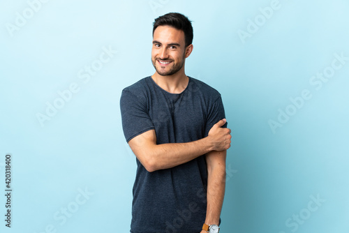 Young handsome man over isolated background laughing