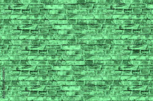 Tinted old brick wall as background.. Abstract green grunge background. Green vintage banner. Copy space.