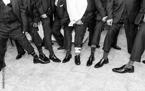 Men showing off wacky socks