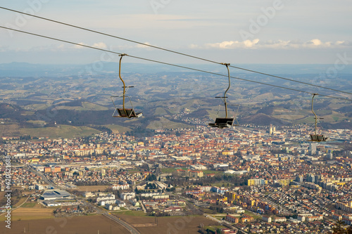 Maribor city from Pohorje, Slovenia. Chairlits with cirty in the background. photo