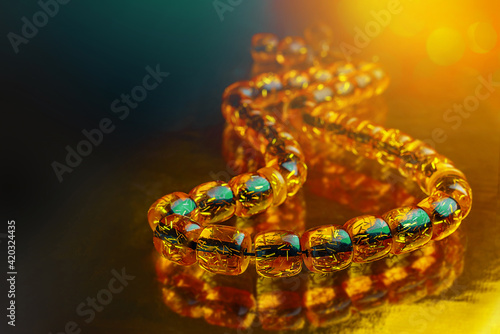 Ramadan Karim greeting background Islamic prayer bead, rosary. Rosary of amber. photo