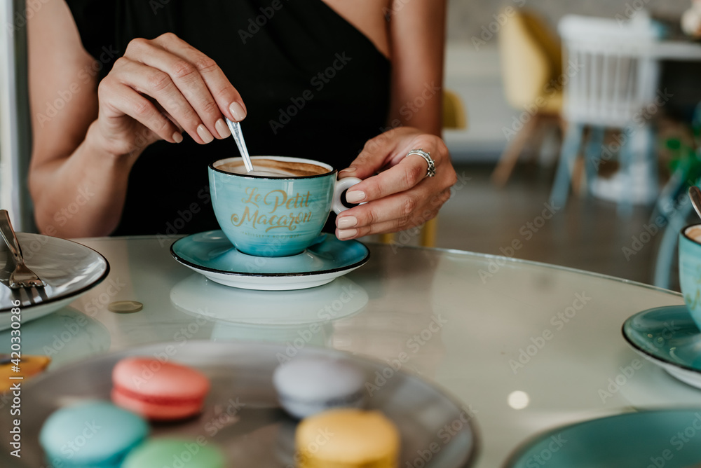 person holding a cup of coffee person holding a cup of coffee