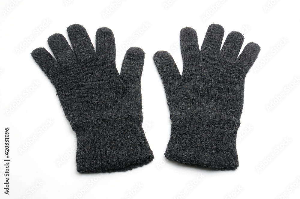 Winter knitted woolen gloves on a white background Winter knitted woolen gloves on a white background