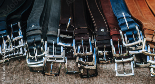 Lots leather belts background. Classic men's leather belts © Augustas Cetkauskas