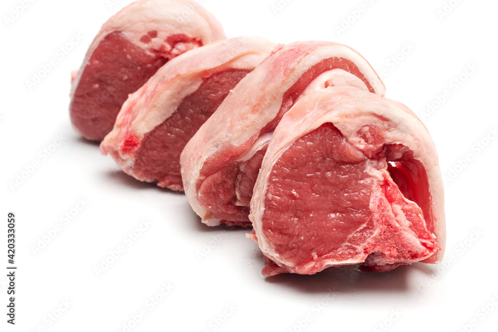 Fresh lamb loin chops on a white isolated background. Meat industry product.