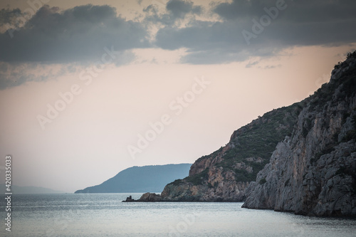 Sunset on the coast of greek island © djordjenikolic