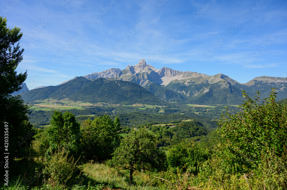 Panoramic view on Grande tete de Obiou mountain range in French Prealps in Isere, highest peak of Devoluy Mountains in summer Panoramic view on Grande tete de Obiou mountain range in French Prealps in Isere, highest peak of Devoluy Mountains in summer