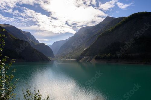 Blue mountain lake Lac Chambon in French Alps in summer