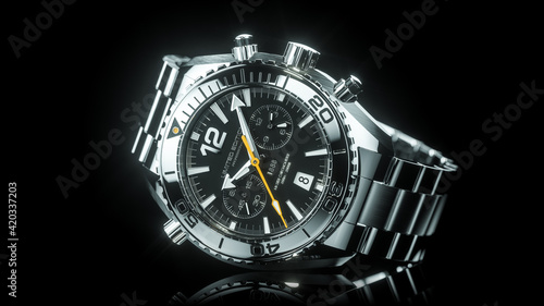 Mechanical stainless steel wristwatch isolated on black background 3d