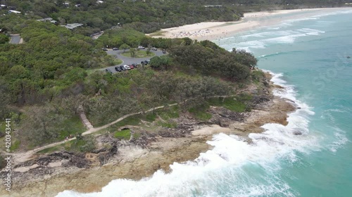 Cars Parked On Cylinder Headland Foreshore - Coastal Walk With Crashing Waves Near Cylinder Beach In Point Lookout, QLD, Australia. - aerial photo