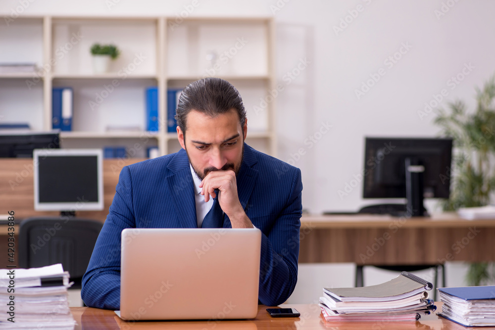 Young businessman employee working at workplace Young businessman employee working at workplace