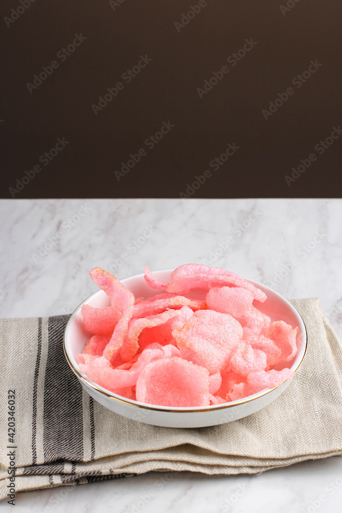Red Crackers or kerupuk Merah Made from Tapioca Flour, Usually Served for Accompanied Lontong Sayur Padang (Minangnese Vegetable Curry) Red Crackers or kerupuk Merah Made from Tapioca Flour, Usually Served for Accompanied Lontong Sayur Padang (Minangnese Vegetable Curry)