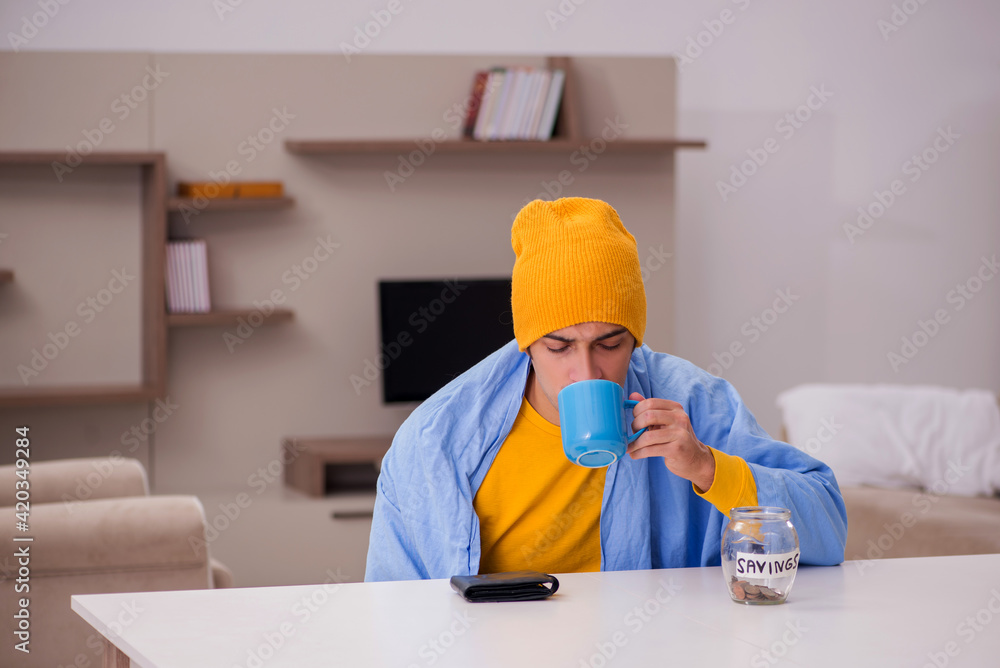 Young man suffering at home in expensive medicine concept Young man suffering at home in expensive medicine concept