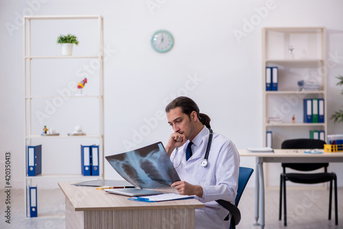 Young male doctor radiologist working in the clinic