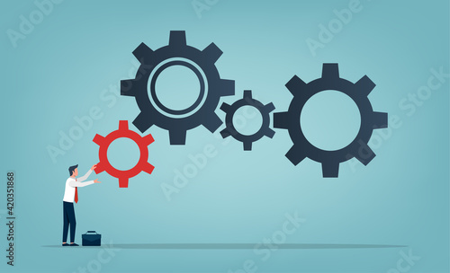 Businessman rolling a small red gear to large gears symbol. Business concept and increase of efficiency and productivity illustration.