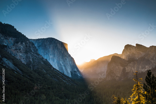 early summer morning sunrise in Yosemite Valley as viewed from Tunnel View in Yosemite National Park.
