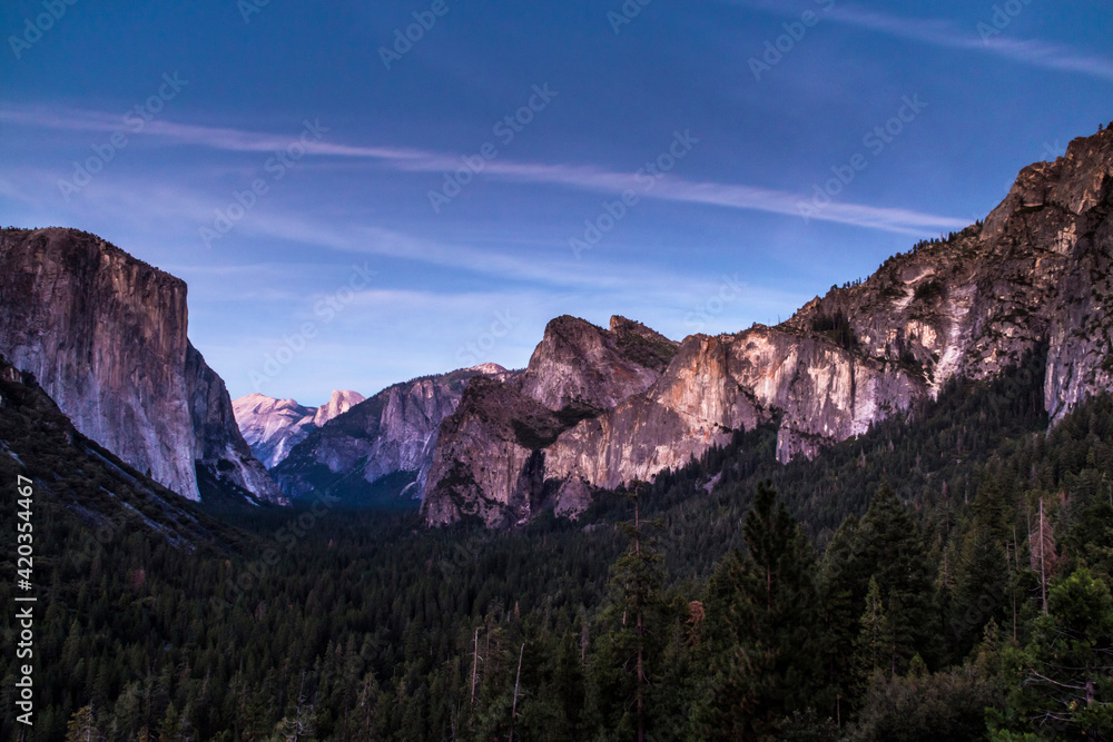 dusk in Yosemite national park . The El Capitan and Half Dome seen from Tunnel View.