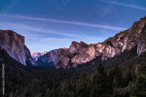 dusk in Yosemite national park . The El Capitan and Half Dome seen from Tunnel View.