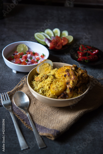 Close up of Mughal delicacy biryani or traditional rice cooked with chicken and potatoes  photo