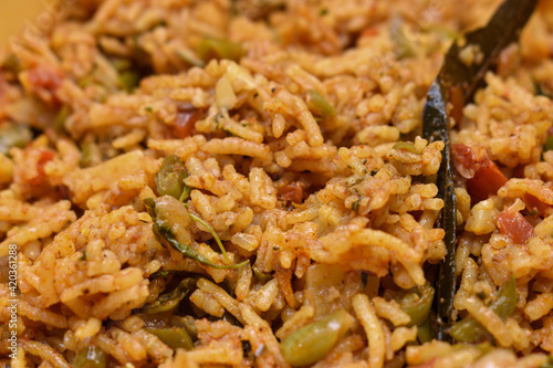 closeup shot of Veg biryani with green chilly as toppings.Texture image for food stalls and banners photo