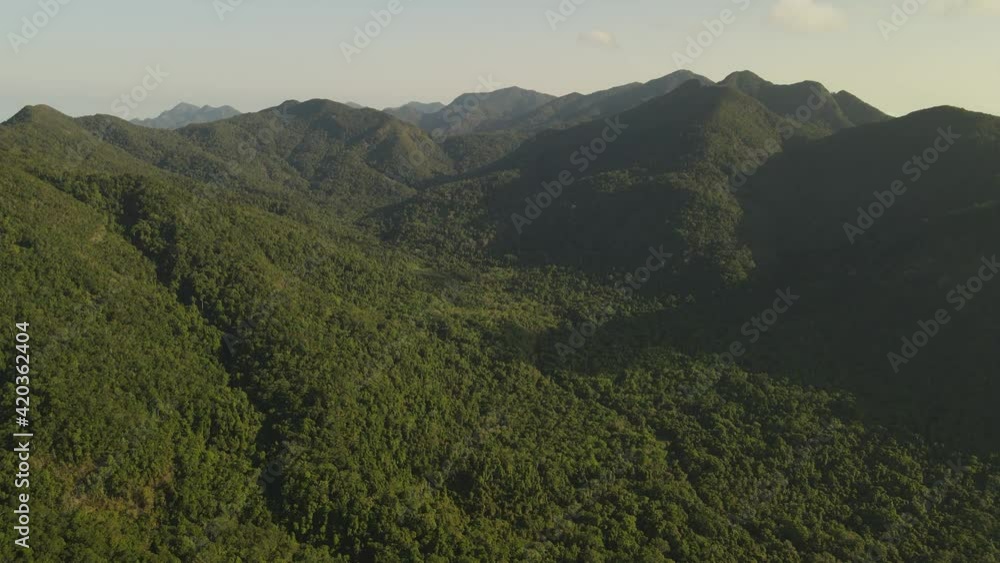 Expansive aerial view high above the green rainforest on the island of Koh Chang, Thailand. Expansive aerial view high above the green rainforest on the island of Koh Chang, Thailand.