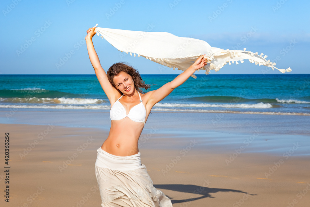 Attractive young woman enjoying the ocean beach on Fuerteventura Attractive young woman enjoying the ocean beach on Fuerteventura