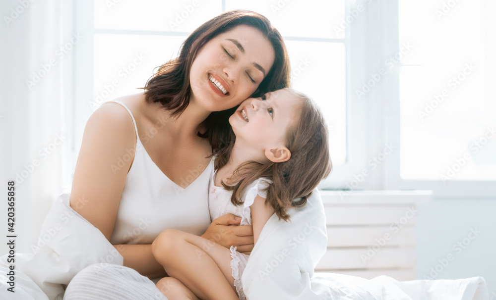 girl and her mother enjoy sunny morning girl and her mother enjoy sunny morning