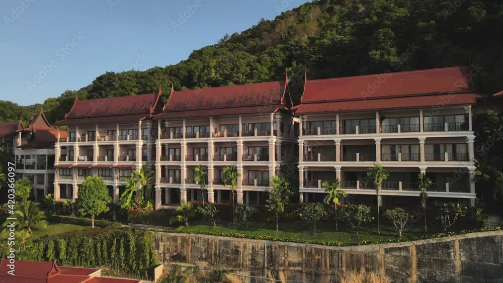 Rotating aerial shot of a large red roofed resort on the island of Koh Chang, Thailand. Rotating aerial shot of a large red roofed resort on the island of Koh Chang, Thailand.