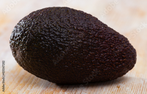 Tasty avocado on wooden surface. High quality photo