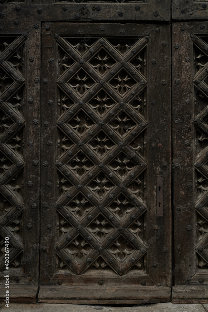 Seven-hundred-year-old entrance door to the basilica in Gdańsk. Carved door. Seven-hundred-year-old entrance door to the basilica in Gdańsk. Carved door.