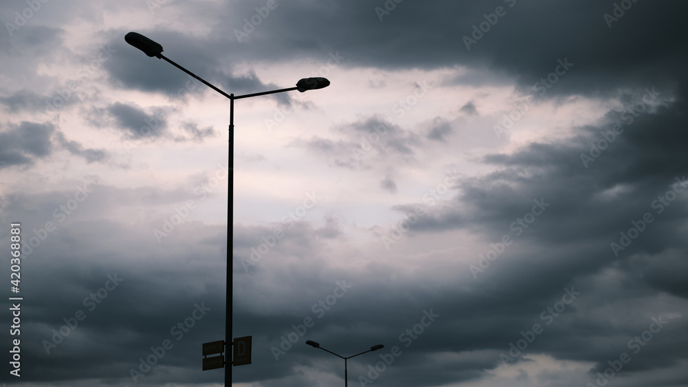 Lantern on the background of the cloudy sky