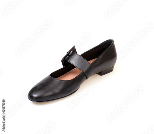 Black leather beautiful low-heeled black shoes isolated on white background