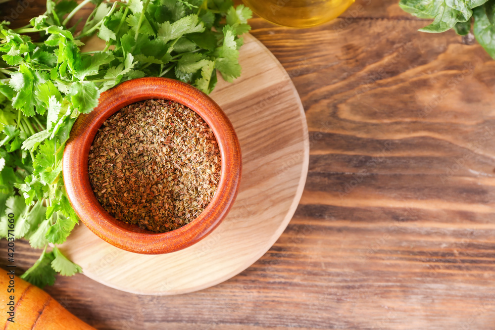 Mortar with spices and pestle on wooden background Mortar with spices and pestle on wooden background
