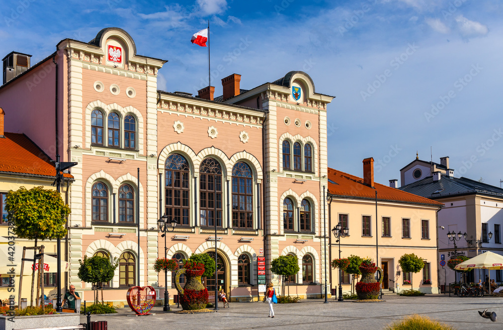 Naklejka premium City hall building with colorful town tenement houses at historic city center market square in Zywiec, Silesia region of Poland