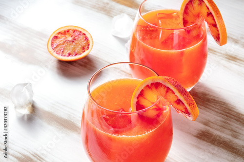 Orange cocktail close-up, decorated with blood orange slices