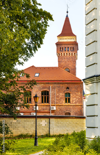 Zywiec, Poland - August 30, 2020: Historic neo-gothic brick tenement house with keep tower at Kosciuszki street in Zywiec historic city center in Silesia region of Poland