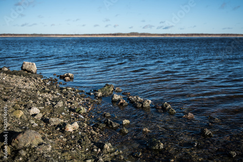 Stones on the shore of the lake Liepaja, Latvia.