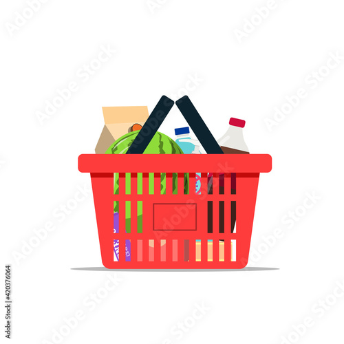 Full shopping basket with various kinds of goods isolated on a white background