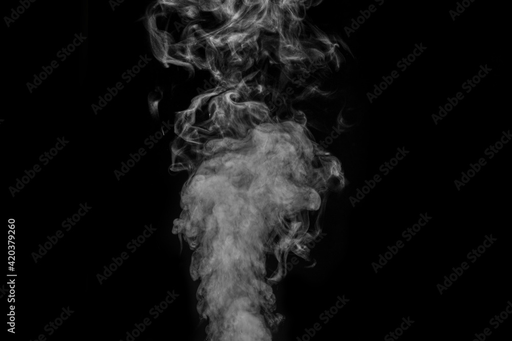 Original white curly steam on a black background. Abstract background, element for design Original white curly steam on a black background. Abstract background, element for design