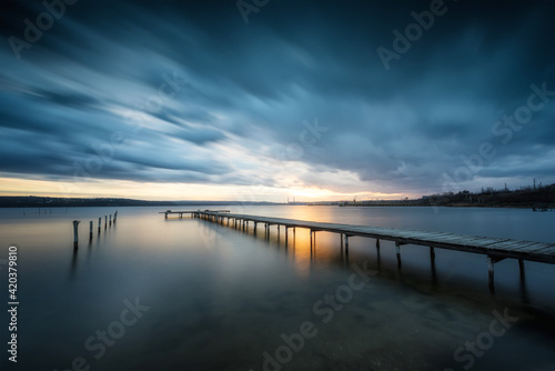 The last sunlight. Magnificent long exposure lake view after sunset.