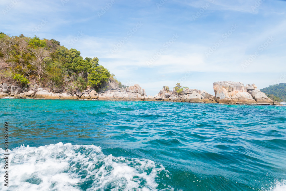 Sea waves on the beautiful turquoise sea on the beaches of Koh Lipe in Thailand.