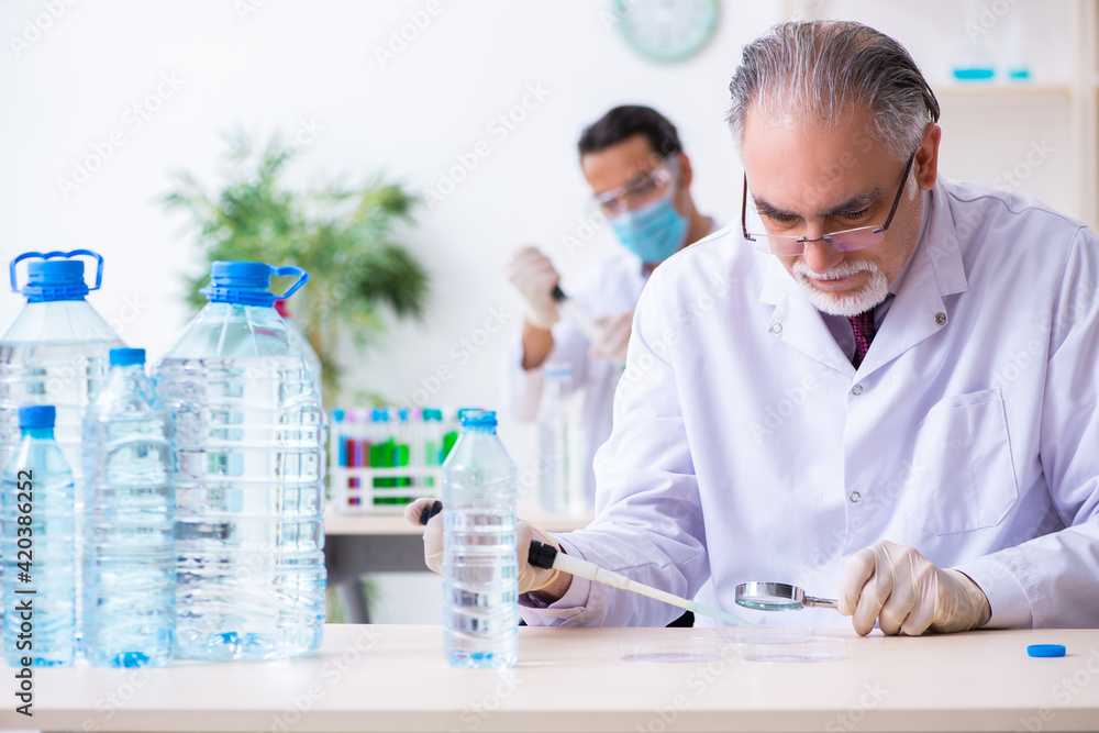 Two chemists working in the lab Two chemists working in the lab