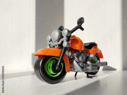 Motorcycle toy on white background with shadow