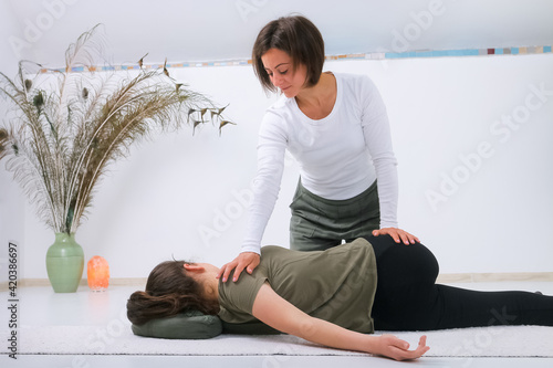 Teenager getting Shiatsu massage from Shiatsu masseuse photo