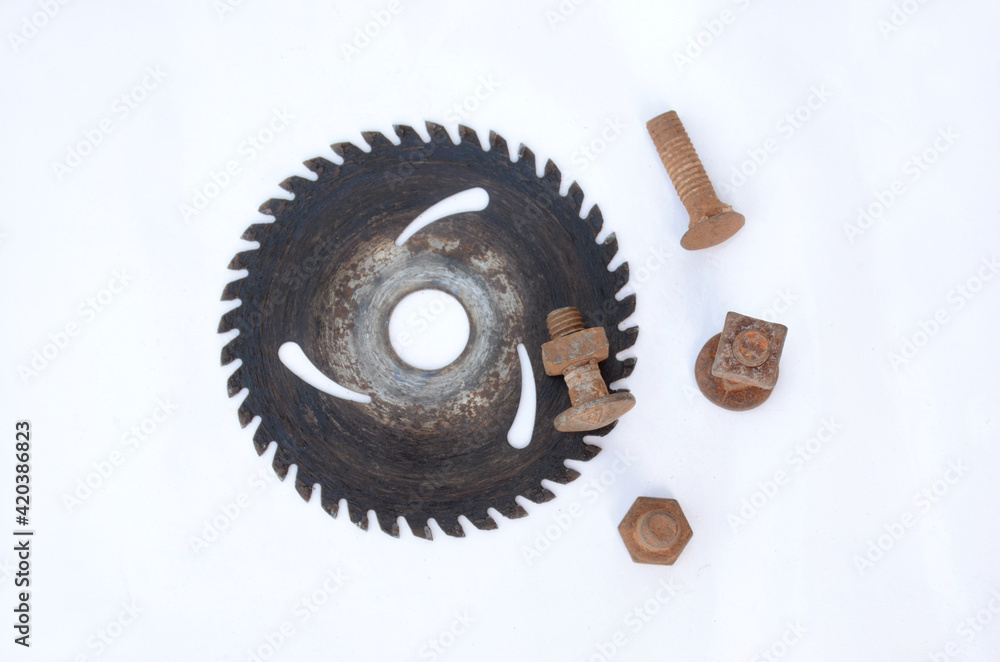 old retro iron cutter blade with nut bolt isolated on white background. old retro iron cutter blade with nut bolt isolated on white background.