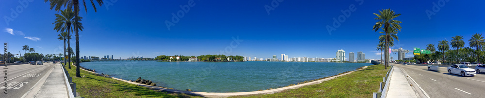 MIAMI, FL - FEBRUARY 2016: Traffic along MacArthur Causeway on a beautiful winter day MIAMI, FL - FEBRUARY 2016: Traffic along MacArthur Causeway on a beautiful winter day