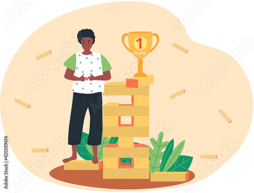 Future goals concept with happy dark skinned guy standing near jenga tower with gold cup on top