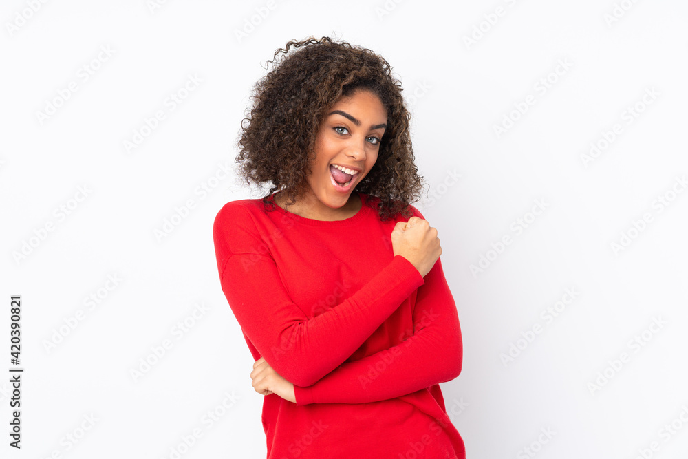 Young African American woman isolated on background celebrating a victory Young African American woman isolated on background celebrating a victory
