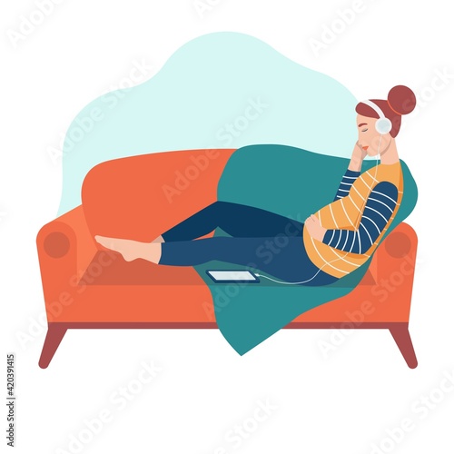 A pregnant woman sits on the sofa and listens to music with headphones. The concept of everyday activities and daily life. Flat cartoon vector illustration.